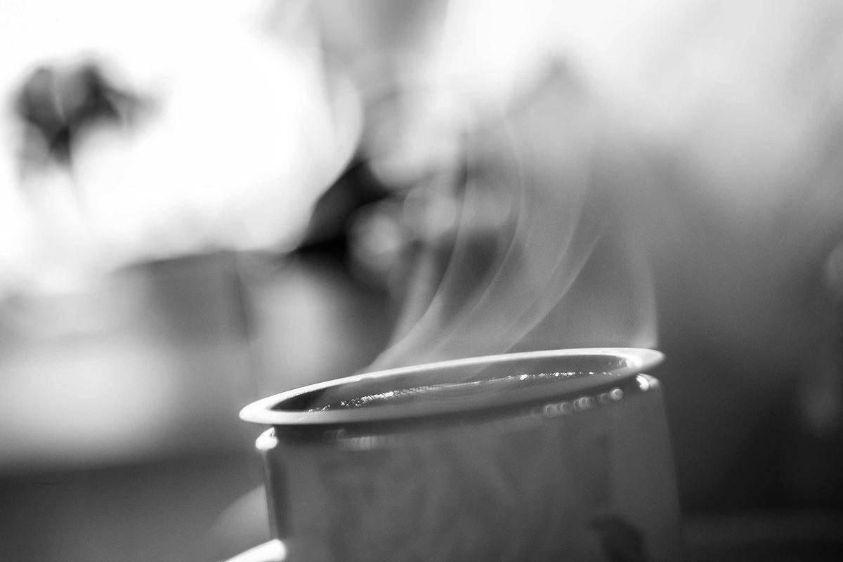 Cup of coffee photographed against soft window light