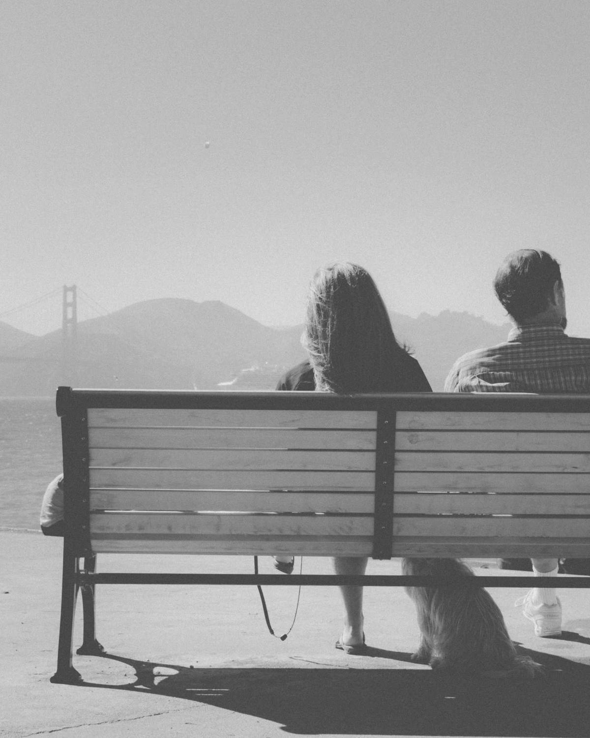 Couple sitting together on a park bench