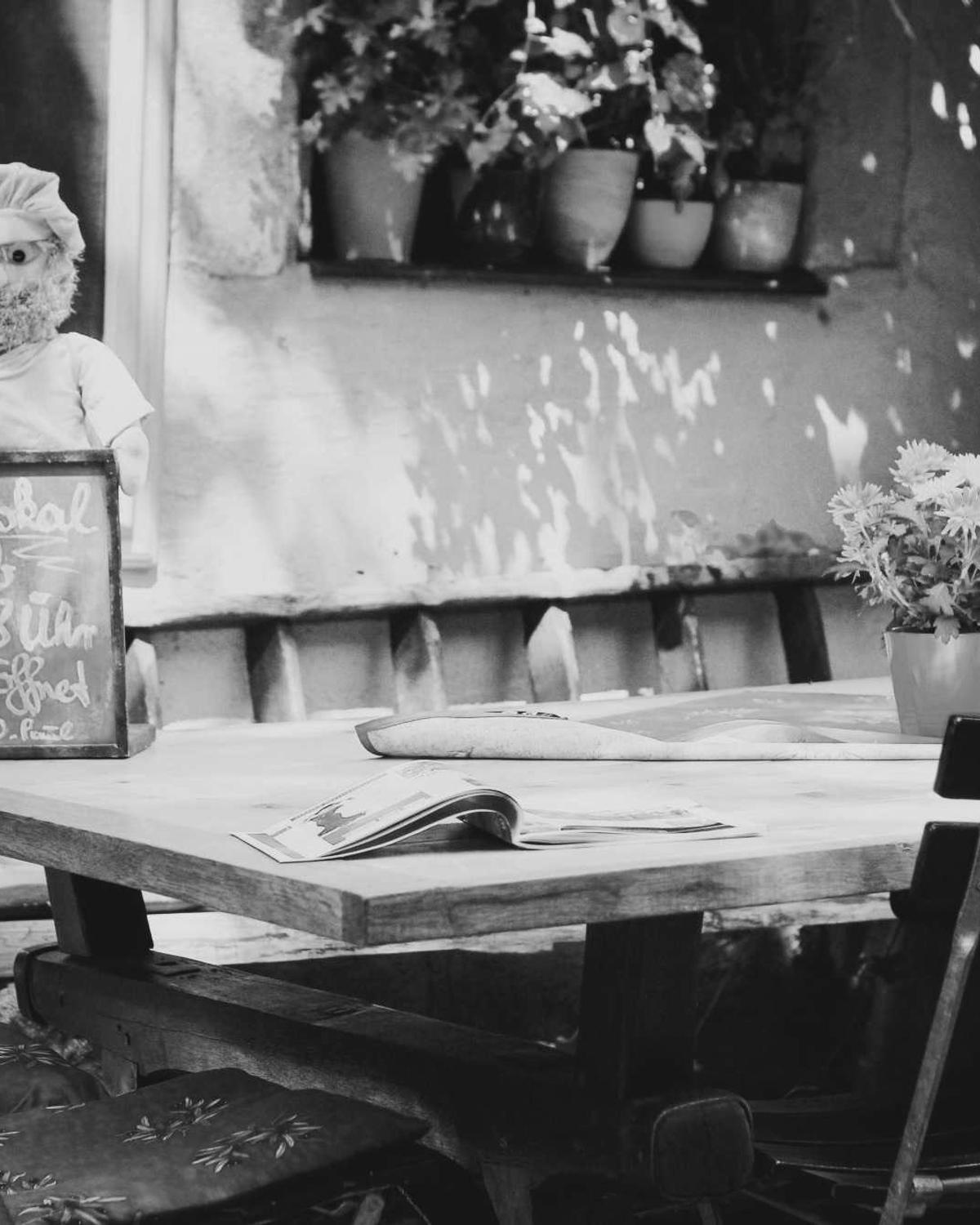 Café table and chairs on a quiet street