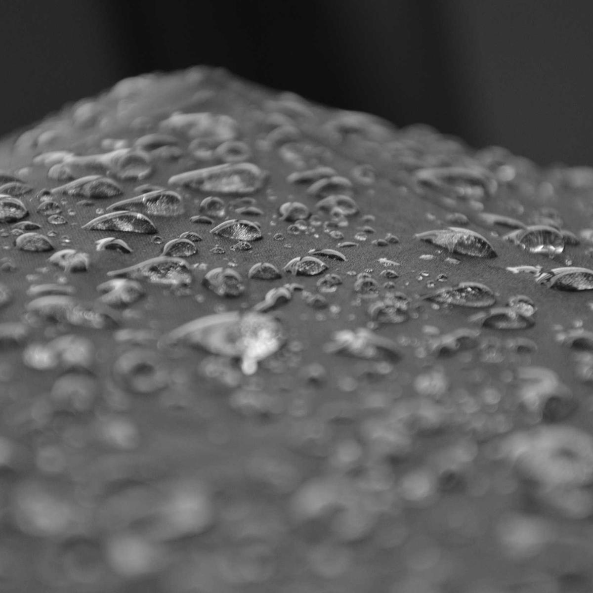 Water droplets on a dark textured surface